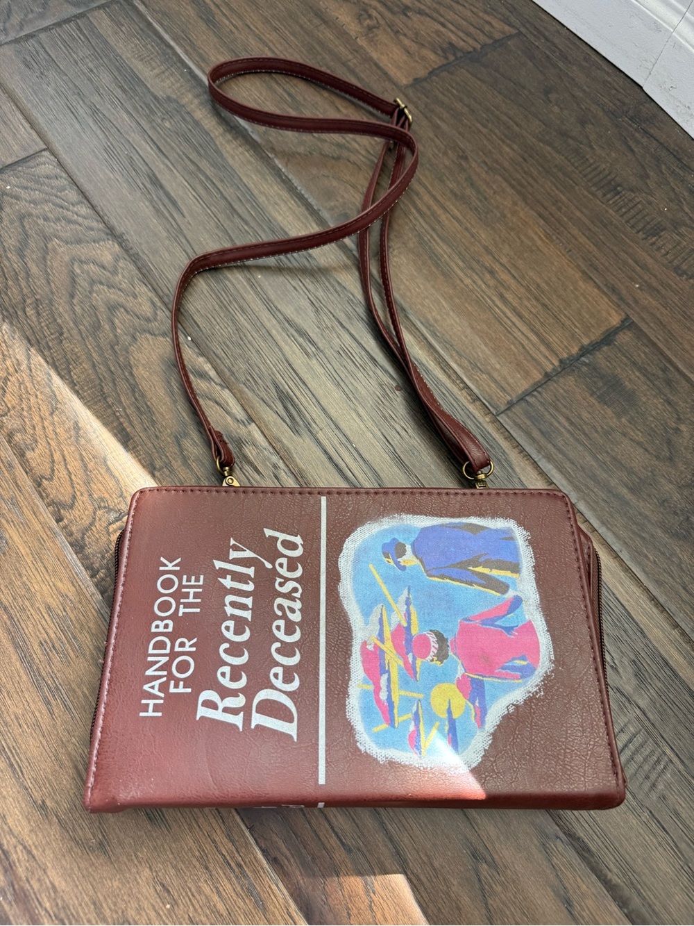 Handbook for the Recently Deceased Burgundy Crossbody Bag